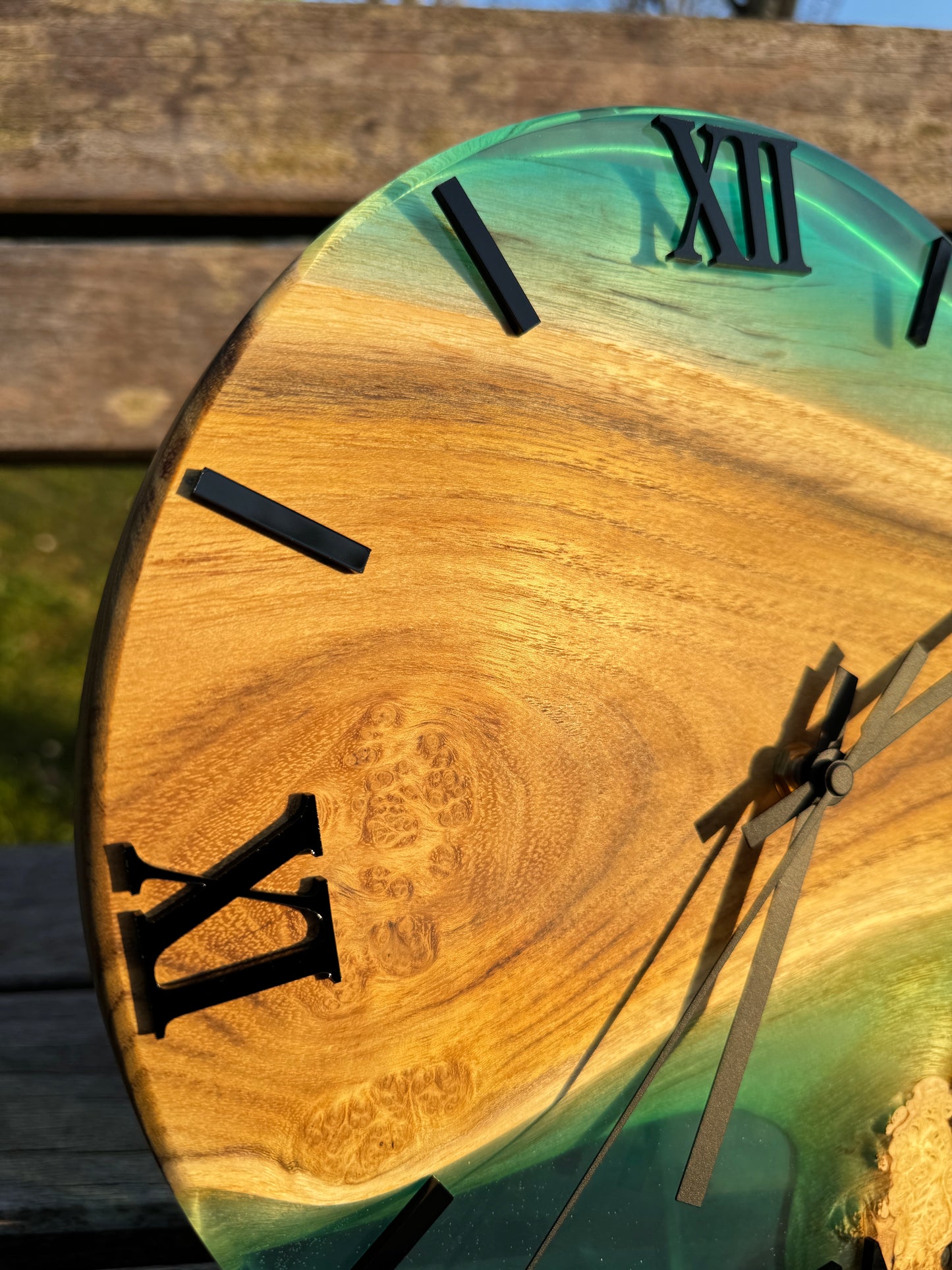 Blue Lagoon – Wall clock made of robinia wood with burls and transparent epoxy resin