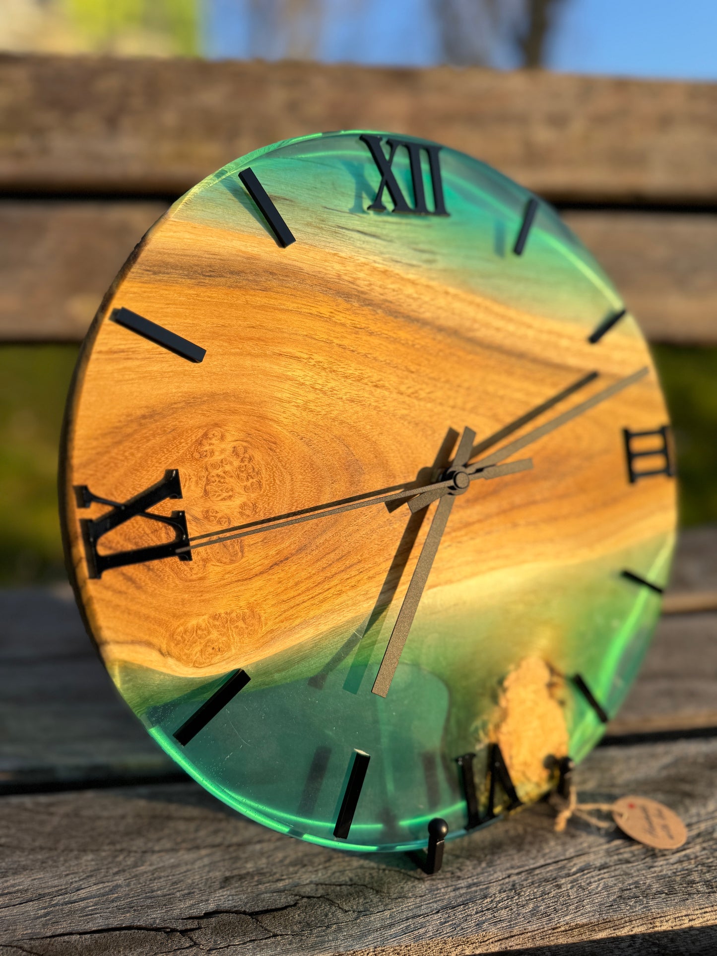 Blue Lagoon – Wall clock made of robinia wood with burls and transparent epoxy resin