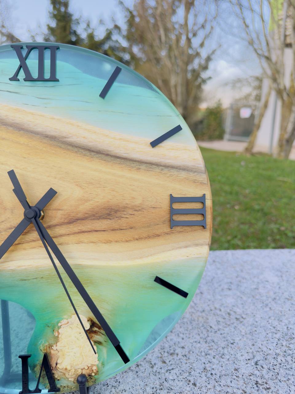 Blue Lagoon – Wall clock made of robinia wood with burls and transparent epoxy resin