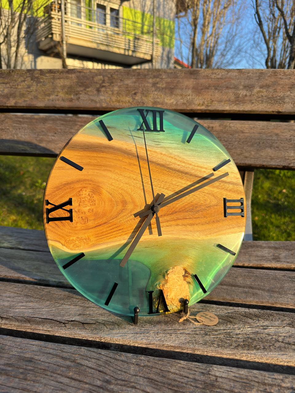 Blue Lagoon – Wall clock made of robinia wood with burls and transparent epoxy resin